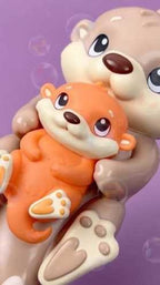 Baff Buddies Mamá y Bebé Nutria: Juguete Flotante de Baño con 3 Bombas de Lavanda